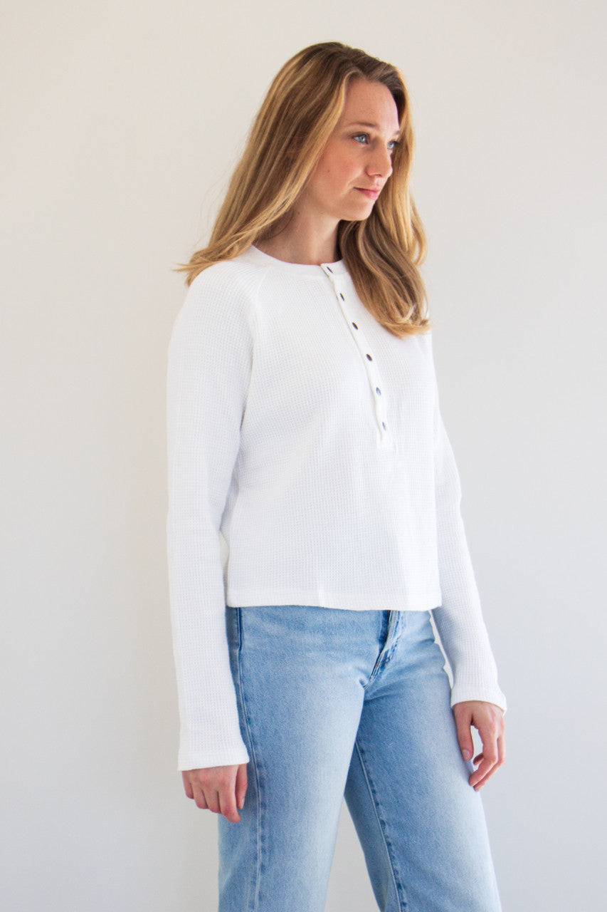 This elevated top features a unique henley button down style, with our signature 100% cotton waffle fabric. Comforting and soft, this boxy long sleeve is the perfect for a casual outfit.

