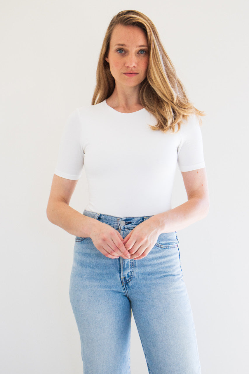 An essential bodysuit with a close fit and lightweight fabric, Pavani features a solid and smooth finish with a crew cut neckline, tee sleeve and just a little bit of stretch.

