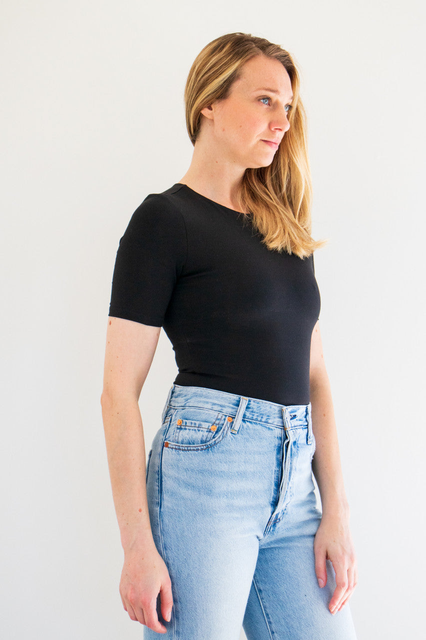 An essential bodysuit with a close fit and lightweight fabric, Pavani features a solid and smooth finish with a crew cut neckline, tee sleeve and just a little bit of stretch.

