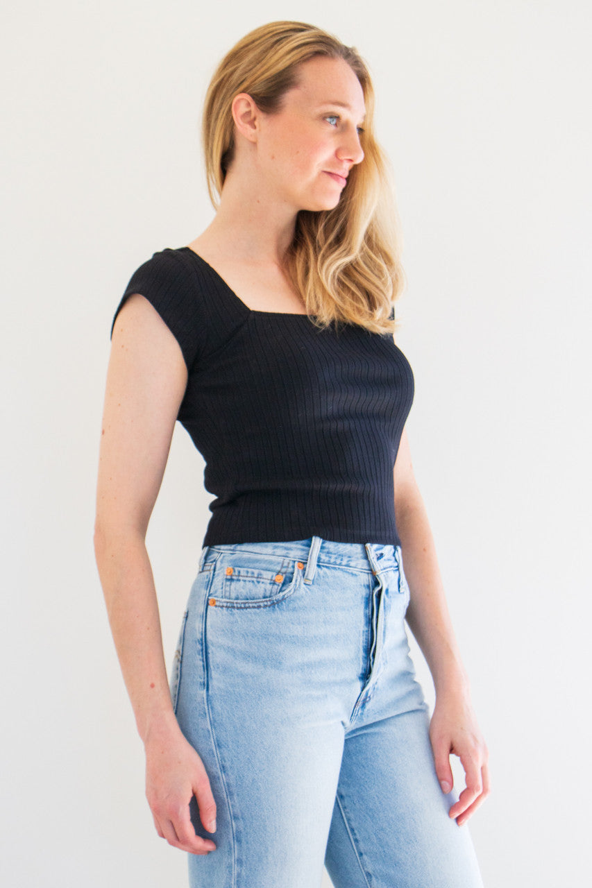 A classic ribbed tee with cap sleeve details and a boxy, squared off neckline. This tee fits true to size with a slightly fitted finish. Made to pair and wear with anything and everything, stock up on staple basics. 

