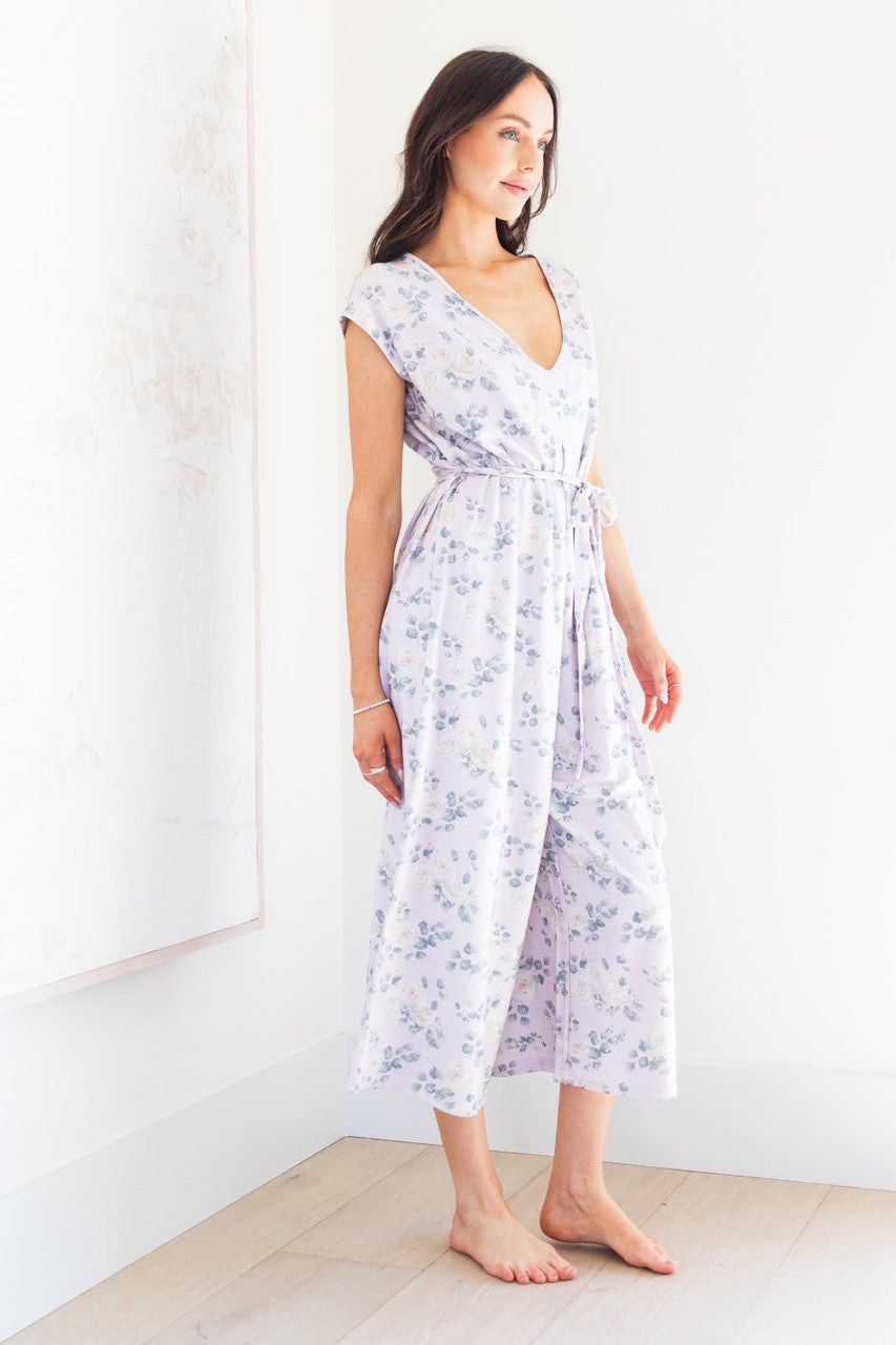 Introducing our white rose print women's romper, made from soft lilac modal fabric. Featuring a tie waist and delicate floral pattern, this romper is both comfortable and stylish. Perfect for any occasion, dress it up or down for a versatile addition to your wardrobe. 
